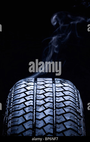 Detail of smoke coming from a car tire Stock Photo