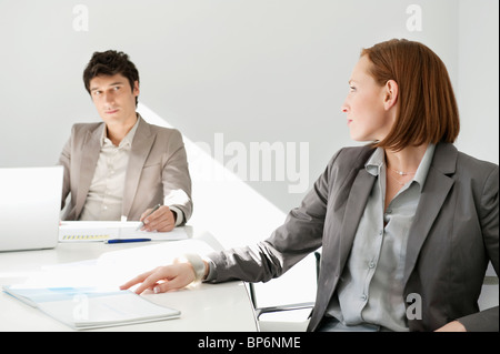 Business executives discussing in a conference room Stock Photo