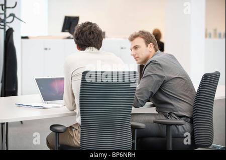 Two businessmen working in an office Stock Photo