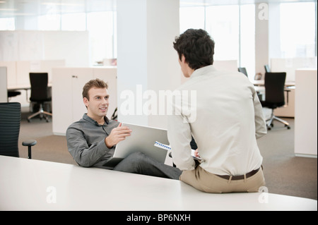 Two businessmen working in an office Stock Photo