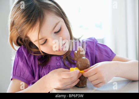 Close-up of a girl playing with an Easter bunny Stock Photo