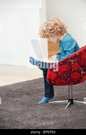 Boy using a laptop Stock Photo