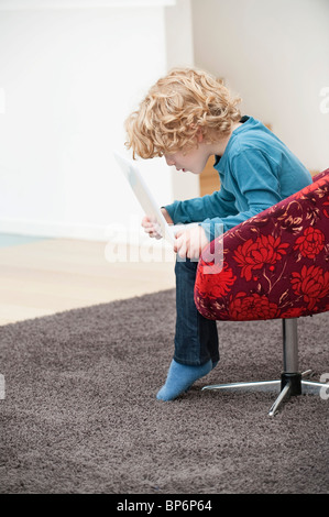 Boy using a laptop Stock Photo
