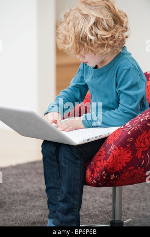 Boy using a laptop Stock Photo