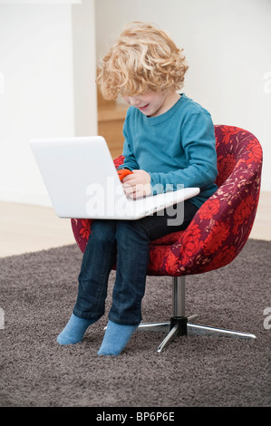 Boy playing with a mobile phone Stock Photo
