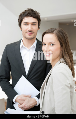 Portrait of two business executives smiling Stock Photo