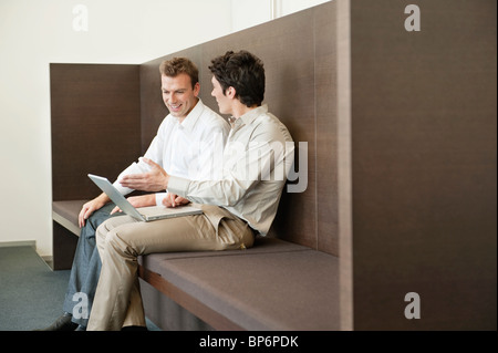 Two businessmen working in an office Stock Photo