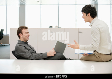 Two businessmen working in an office Stock Photo