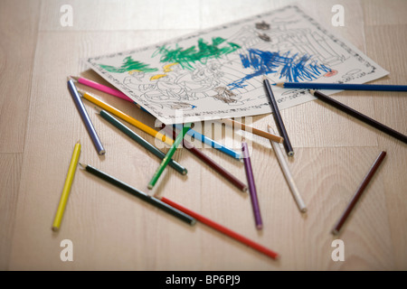 A coloring book page and colored pencils, still life Stock Photo