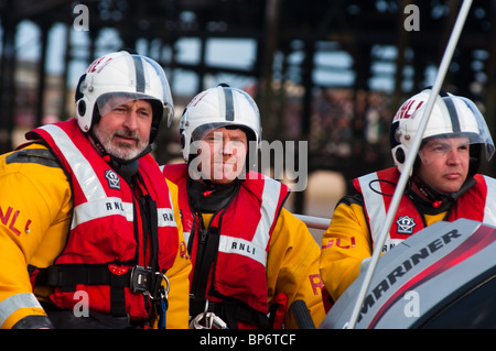 RNLI (Royal National Lifeboat Institution) personnel on manoeuvres at Blackpool beach, England. Stock Photo