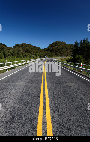 A view down the middle of State Highway 10 between Napier and Wairoa where it passes over the Mohaka River, New Zealand Stock Photo