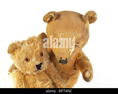 Two 1950 teddy bears having a cuddle.. Stock Photo