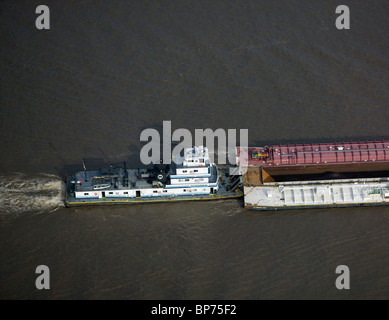 aerial view above Mississippi Inland Marine tug boat pushing barges Mississippi River Baton Rouge Louisiana Stock Photo