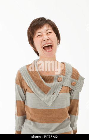 Studio portrait of mature woman laughing Stock Photo - Alamy