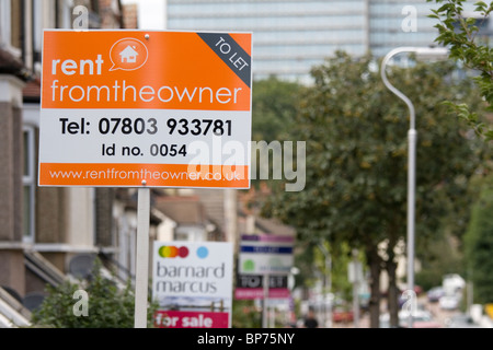 Estate agent boards in London street. Stock Photo