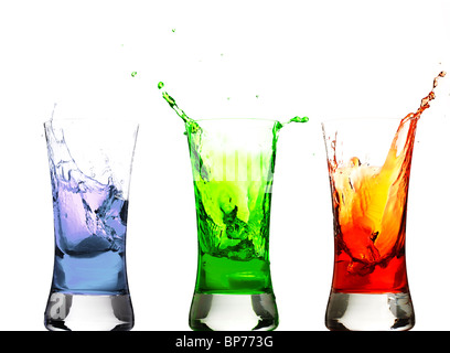 ice cubes thrown in some glasses with drinks Stock Photo