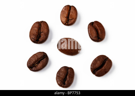 closeup of one coffee bean surrounded by other coffee beans Stock Photo