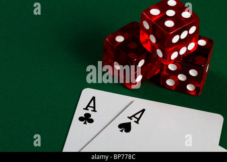 two aces and three dices on green background Stock Photo