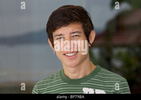 Thai man smiling at camera Stock Photo