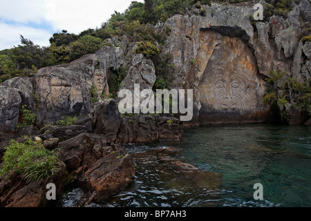 Rock carvings in Mine Bay, Taupo, New Zealand Stock Photo