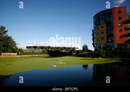 Olympic Stadium in Stratford seen from Hertford Union Canal and River Lea at Fish Island, Hackney Wick, London, UK Stock Photo