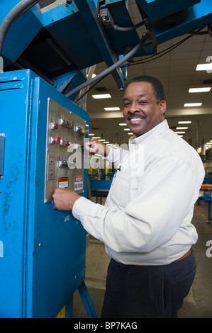 Man working in newspaper factory Stock Photo