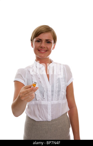 Woman holding usb memory stick - focus on stick Stock Photo