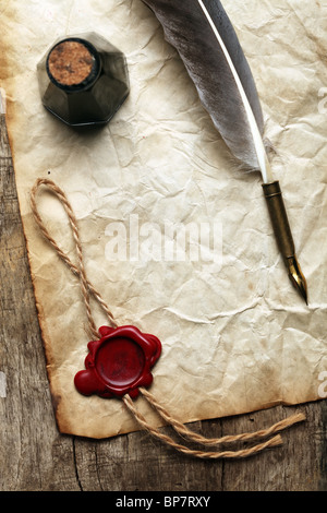 Blank paper with wax seal, quill & ink Stock Photo