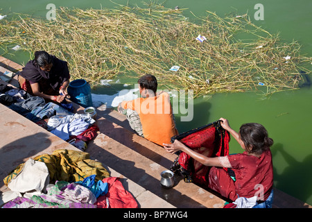 Indian women doing the laundry. Ana Sagar lake. Ajmer. Rajasthan. India Stock Photo