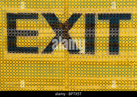 Exit Sign with yellow background Stock Photo