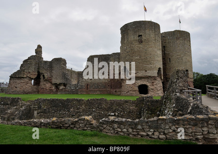 A view across the dry moat to the romantic ruins of Rhuddlan Castle in North Wales Stock Photo