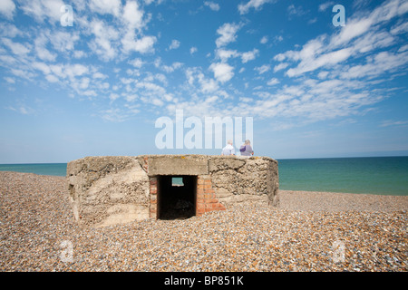 An old pill box left over from the 2nd World War on the Beach near Weybourne, Norfolk, UK. Stock Photo