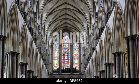 Columns and Rear Stained Glass at Salisbury. A high-resolution detailed image of the ceiling, rear windows and supporting column Stock Photo