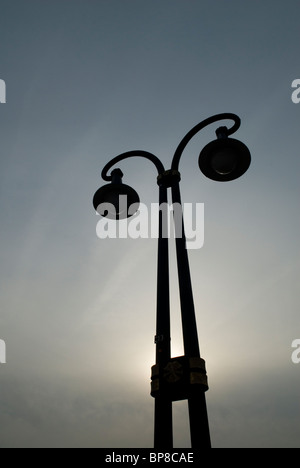 Lamppost silhouetted at sunset Berlin Germany Europe Stock Photo
