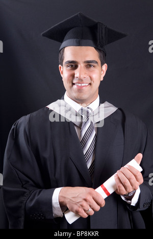 Studio portrait of male graduate in red gown in wheelchair Stock Photo ...