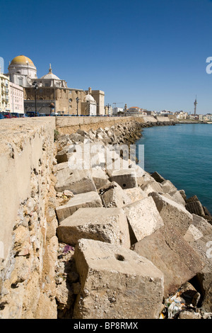 Spanish sea defence / defences made from concrete and stone blocks / block on a beach of Cadiz. Spain. Stock Photo