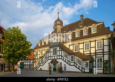 Town hall  (half-timbered house from 1804) and sculpture called Augenblicke by Christel Lechner, Rietberg, Kreis Guetersloh, Teu Stock Photo