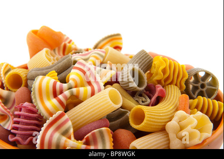 Colorful funny striped pasta in bowl isolated over white Stock Photo