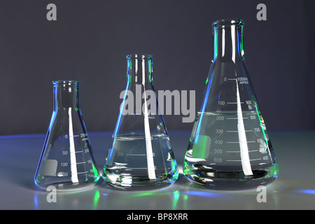 Flasks with fluid in laboratory setting Stock Photo