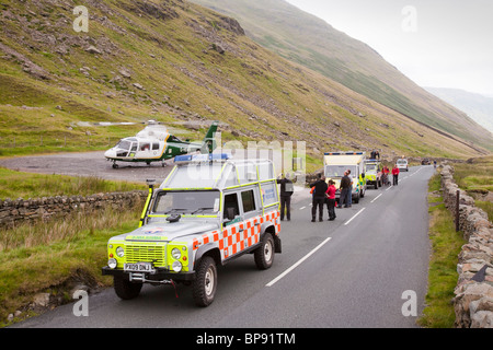 Emergency services attend a motorbike crash on Kirkstone Pass in the Lake District Stock Photo