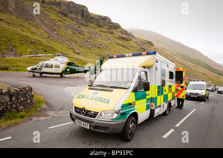 Emergency services attend a motorbike crash on Kirkstone Pass in the Lake District Stock Photo