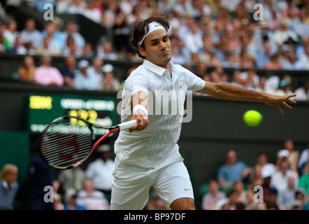 Roger Federer of Switzerland hits a ball during the Gentlemen's singles ...