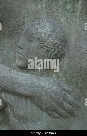 sculpture of a baby and mother's hand in Marx Engels forum Berlin Germany Stock Photo