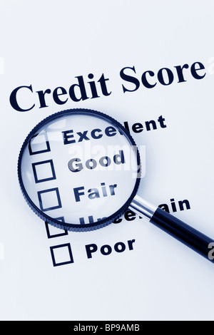 Credit Score and Magnifying Glass Stock Photo