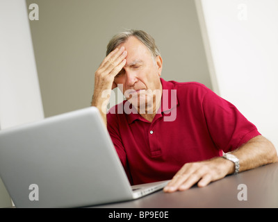 senior man using laptop computer Stock Photo