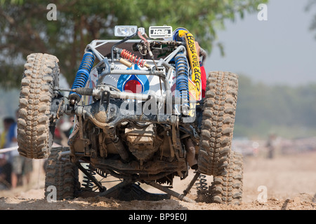 Off-road dune buggy competing in the mud Stock Photo