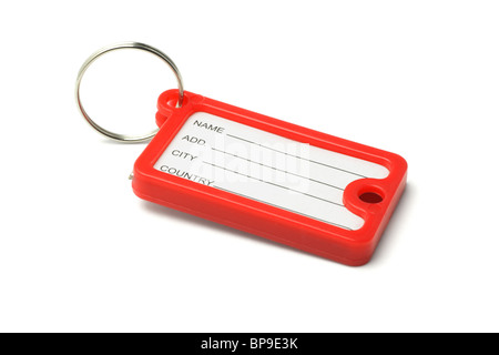 Red plastic key label on white background Stock Photo