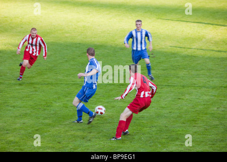 Ambleside FC playing Ulverston Town football club at Ambleside's football pitch, Lake District, UK. Stock Photo