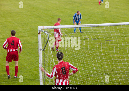 Ambleside FC playing Ulverston Town football club at Ambleside's football pitch, Lake District, UK. Stock Photo