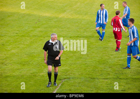 Ambleside FC playing Ulverston Town football club at Ambleside's football pitch, Lake District, UK. Stock Photo